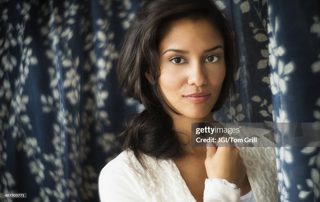 Hispanic woman smiling indoors