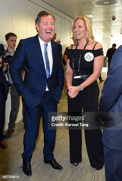 Piers Morgan and Michelle Mone attend the annual BGC Global Charity Day at BGC Partners on September 11, 2015 in London, England.
