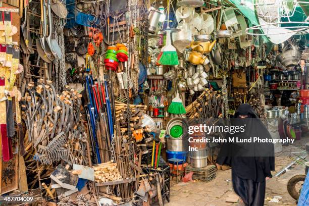 woman walking in saana market, yemen - yemen people stock pictures, royalty-free photos & images