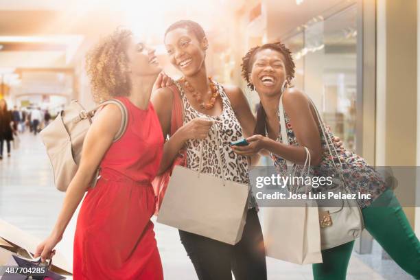 women shopping together in mall - african woman shopping stock-fotos und bilder