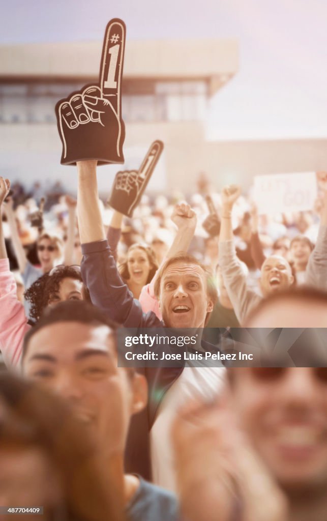 Spectators cheering at sporting event