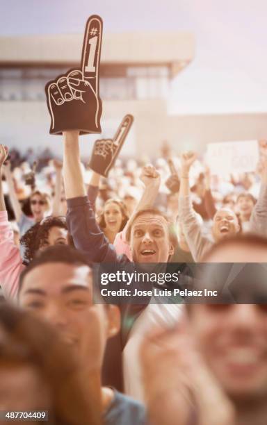 spectators cheering at sporting event - foam hand bildbanksfoton och bilder