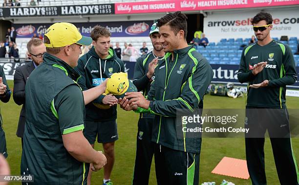 Aaron Finch presents Marcus Stoinis of Australia with his first ODI cap ahead of the 4th Royal London One-Day International match between England and...