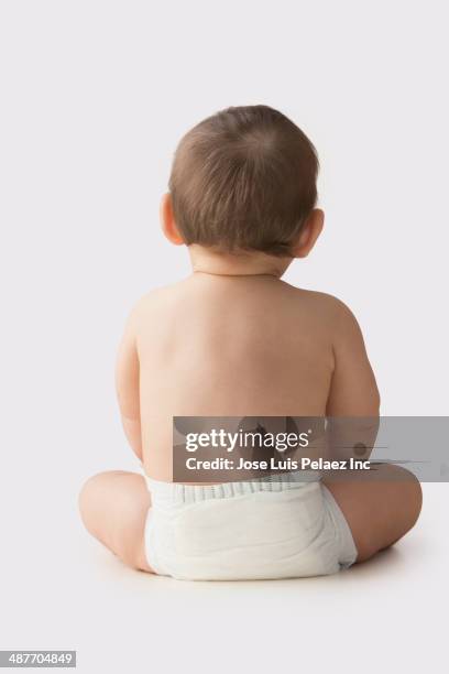 hispanic baby boy sitting - baby studio shot stock pictures, royalty-free photos & images