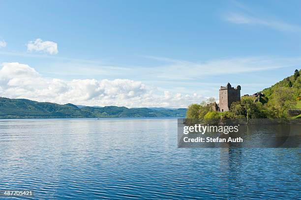 tower of the ruins of urquhart castle on the banks of loch ness, near drumnadrochit, scottish highlands, scotland, united kingdom - loch ness stock pictures, royalty-free photos & images