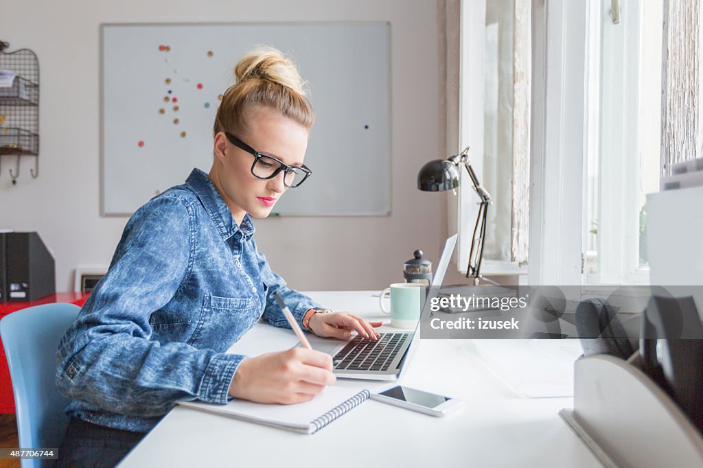 Woman working on computer in an office