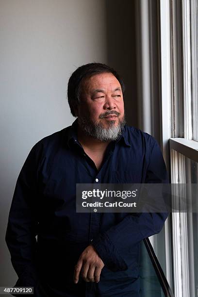 Chinese artist Ai Weiwei poses for a photograph after a press conference at the Royal Academy of Arts on September 11, 2015 in London, England. Ai...