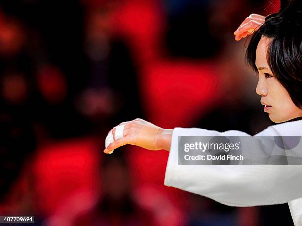 Olympic champion, Kaori Matsumoto of Japan, here looking as though she is practising Tai-Chi, defeated Chen-Ling Lien of Chinese Taipei by an ippon...