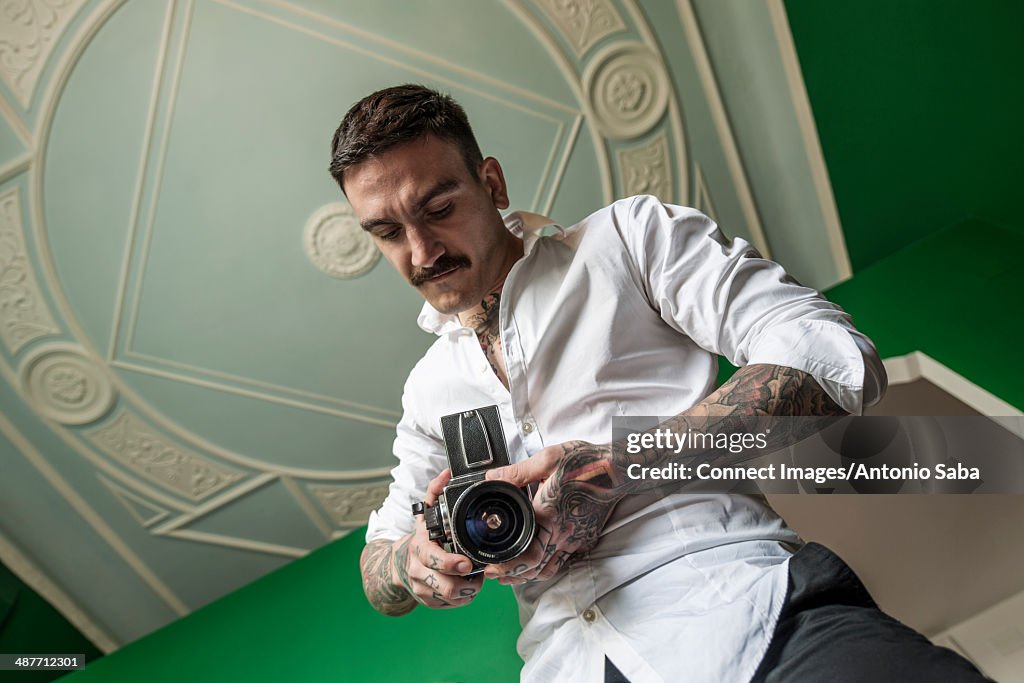 Photographer preparing camera