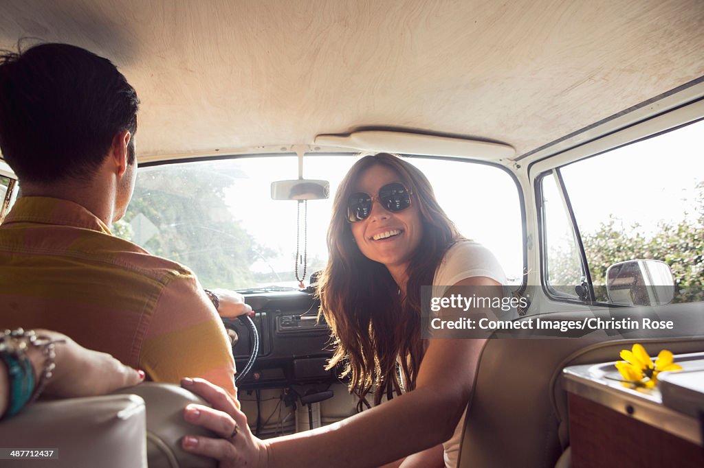 Young happy couple on camper van road trip