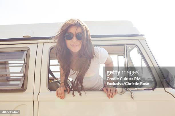 young female on vacation in camper van - cultura americana stock-fotos und bilder