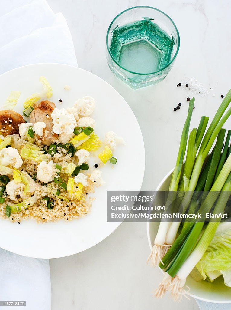 Cauliflower salad dish and spring onions meal