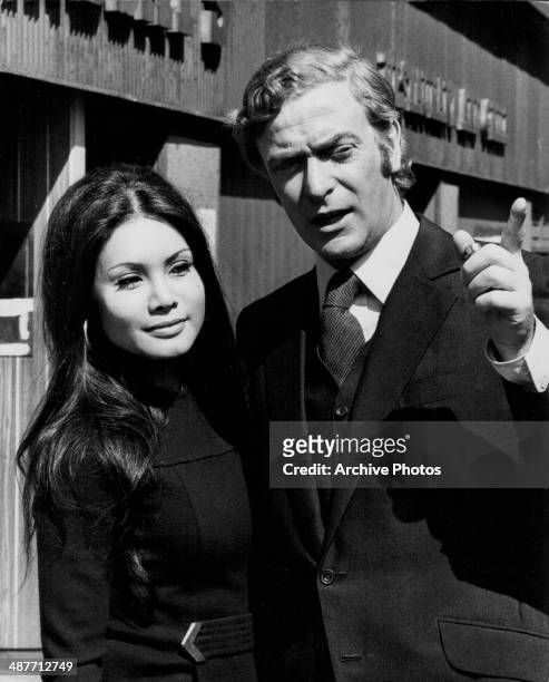 Actor Michael Caine and girlfriend Minda Feliciano on location for the film 'Get Carter', Newcastle-upon-Tyne, England, 1970.