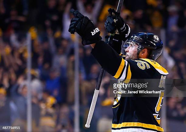 Johnny Boychuk of the Boston Bruins celebrates his goal in the third period against the Montreal Canadiens to force overtime in Game One of the...