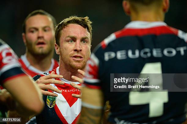 James Maloney of the Roosters speaks to team mates during the NRL qualifying final match between the Sydney Roosters and the Melbourne Storm at...