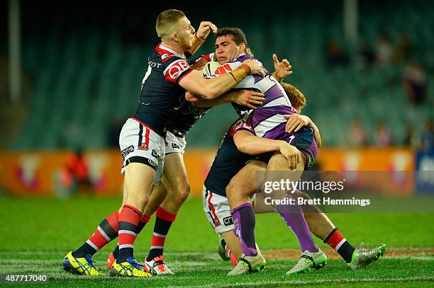 Dale Finucane is tackled during the NRL qualifying final match between the Sydney Roosters and the Melbourne Storm at Allianz Stadium on September...