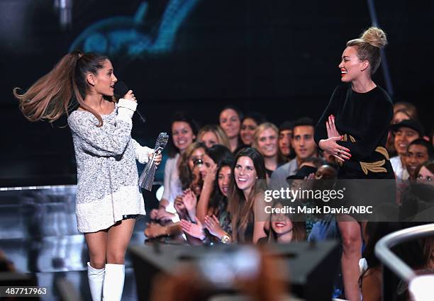 IHEARTRADIO MUSIC AWARDS -- Pictured: Singer Ariana Grande accepts the iHeartRadio Young Influencer Award from actress Hilary Duff onstage during the...