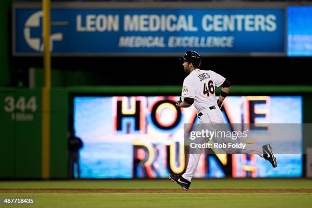 Garrett Jones of the Miami Marlins runs the bases after hitting a solo home run during the second inning the game against the Atlanta Braves at...