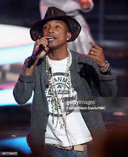 IHEARTRADIO MUSIC AWARDS -- Pictured: Musician Pharrell Williams performs onstage during the iHeartRadio Music Awards held at the Shrine Auditorium...