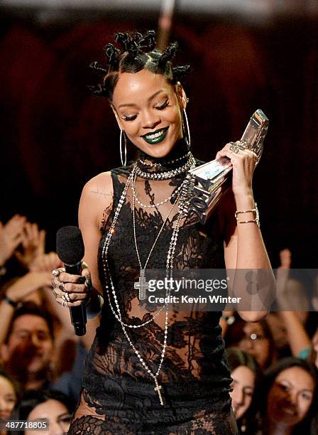 Singer Rihanna accepts the Artist of the Year award onstage during the 2014 iHeartRadio Music Awards held at The Shrine Auditorium on May 1, 2014 in...