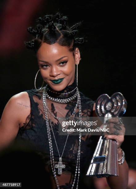 IHEARTRADIO MUSIC AWARDS -- Pictured: Recording artist Rihanna accepts the award for Artist of the Year onstage at the iHeartRadio Music Awards held...