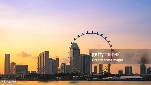 singapore at dusk - merlion stock pictures, royalty-free photos & images