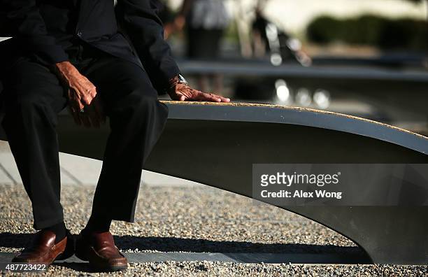 Herb Wolk of Columbia, Maryland, touches the bench that is dedicated to his son-in-law Lt. Darin H. Pontell, who lost his life during the 9/11...