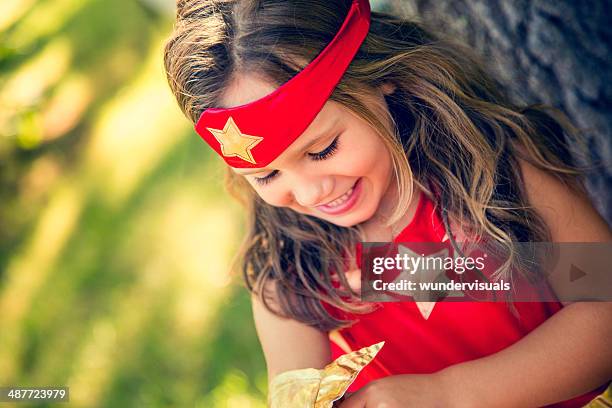 happy superhero girl - superhero girl stock pictures, royalty-free photos & images