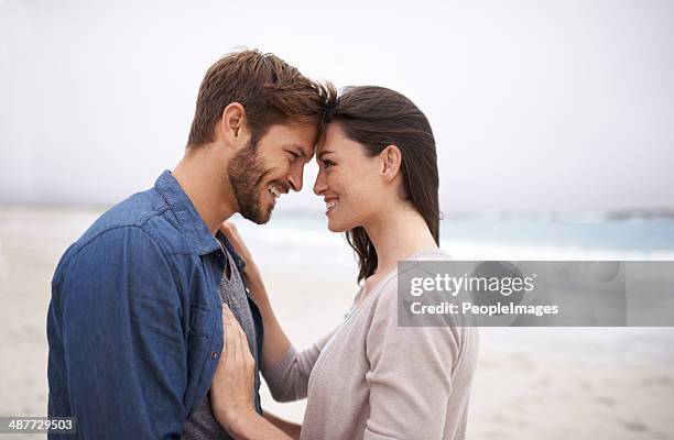 nature brings out that natural kind of love - young couple on beach stock pictures, royalty-free photos & images