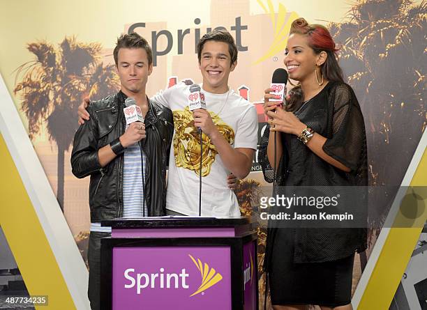 Singer Austin Mahone poses with radio personalities Nathan Fast and Nessa backstage at the 2014 iHeartRadio Music Awards held at The Shrine...