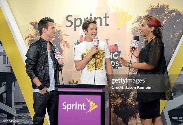 Singer Austin Mahone poses with radio personalities Nathan Fast and Nessa backstage at the 2014 iHeartRadio Music Awards held at The Shrine...