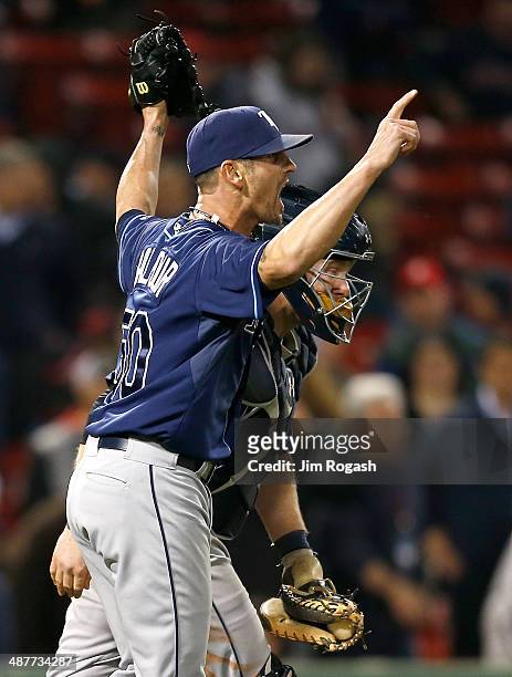 Grant Balfour and Ryan Hanigan of the Tampa Bay Rays celebrate a win against the Boston Red Sox, 6-5, in game two of a doubleheader at Fenway Park...