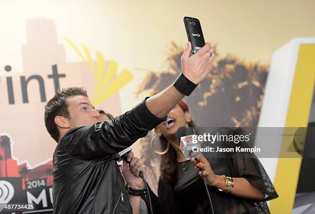 Radio personalities Nathan Fast and Nessa take a selfie backstage at the 2014 iHeartRadio Music Awards held at The Shrine Auditorium on May 1, 2014...