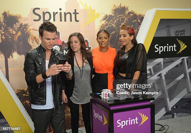 Radio personalities Nathan Fast and Jenn Marino, singer Mel B, and radio personality Nessa pose backstage at the 2014 iHeartRadio Music Awards held...