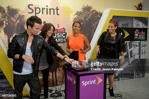 Radio personalities Nathan Fast and Jenn Marino, singer Mel B, and radio personality Nessa backstage at the 2014 iHeartRadio Music Awards held at The...