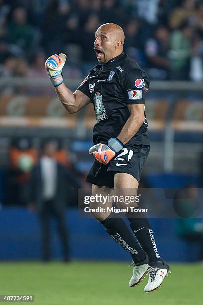 Oscar Perez goalkeeper of Pachuca celebrates after a goal of his teammate Dario Carreo during the Quarterfinal first leg match between Pumas UNAM...