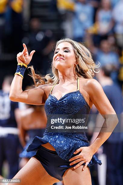 Memphis Grizzlies cheerleader performs during a timeout against the Oklahoma City Thunder during Game Six of the Western Conference Quarterfinals of...