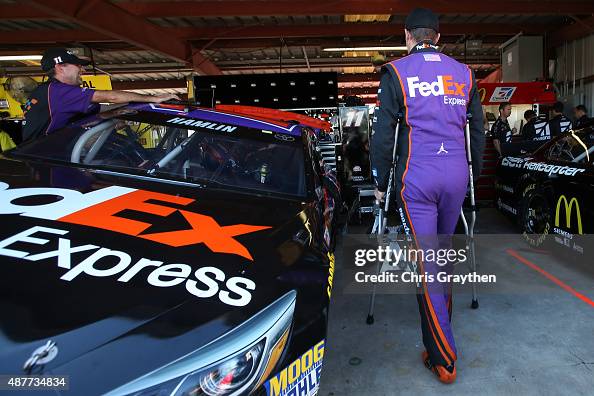 Fedex Racing Tools Denny Hamlin, driver of the FedEx Express Toyota, stands in the... News ...