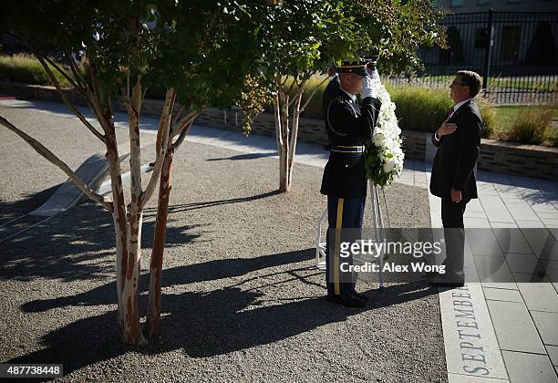 Secretary of Defense Ashton Carter lays a wreath during an observance ceremony at the Pentagon Memorial September 11, 2015 in Arlington, Virginia....