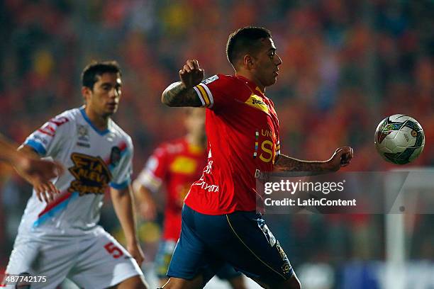 Matias Campos Toro of Union Española fights for the ball with Hugo Ivan Marcone of Arsenal during a match between Unin Espaola and Arsenal as...