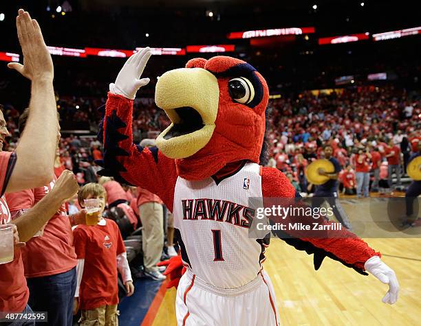 Atlanta Hawks mascot Harry the Hawk high fives the fans in Game 6 of the Eastern Conference Quarterfinals against the Indiana Pacers during the 2014...