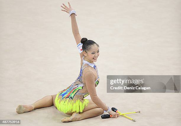 Kaho Minagawa of Japan competes with clubs during the 34th Rhythmic Gymnastics World Championships 2015 on September 11, 2015 in Stuttgart, Germany.