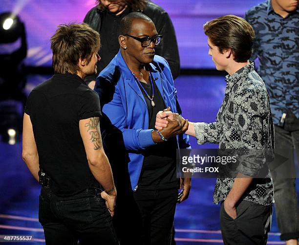 Judge Keith Urban, mentor Randy Jackson and eliminated contestant Sam Woolf onstage at FOX's "American Idol XIII" Top 5 to 4 Live Elimination Show on...