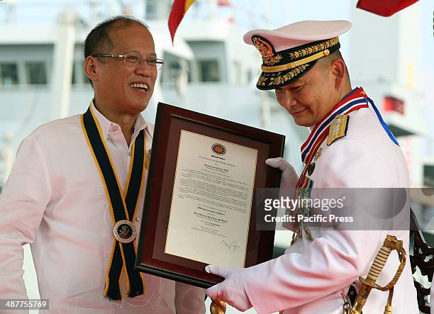 President Benigno S. Aquino III confers the Philippine Legion of Honor with the Degree of Commander to outgoing Philippine Navy Chief Vice Admiral...