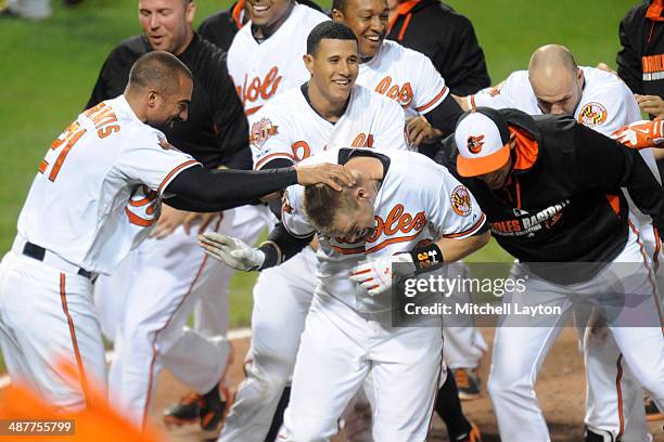 Matt Wieters of the Baltimore Orioles celebrates a walk off home run in the tenth inning during a baseball game against the Pittsburgh Pirates in...