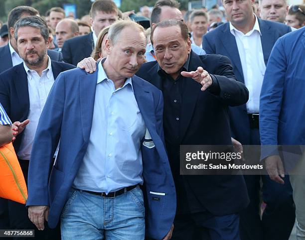 Russian President Vladimir Putin and Former Italain Prime Minister Silvio Berlusconi are seen during a joint walkabout on the streets on September...