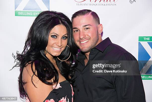 Personality Tracy DiMarco and husband Corey Epstein attend the Posh Boutique fashion show at The Terrace on May 1, 2014 in Paramus, New Jersey.