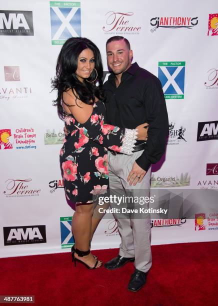 Personality Tracy DiMarco and husband Corey Epstein attend the Posh Boutique fashion show at The Terrace on May 1, 2014 in Paramus, New Jersey.