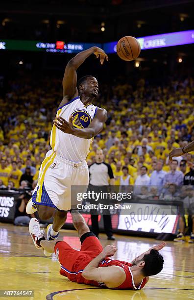 Harrison Barnes of the Golden State Warriors passes the ball after being fouled by J.J. Redick of the Los Angeles Clippers in Game Six of the Western...