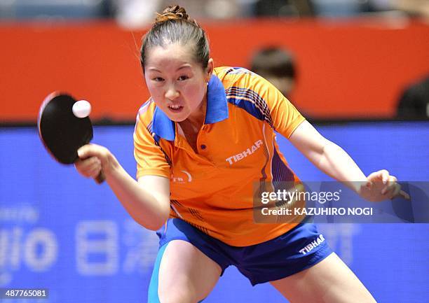 The Netherlands' Li Jie returns a shot against Taiwan's Cheng I-Ching during their match in the women's team championship division knockout rounds at...